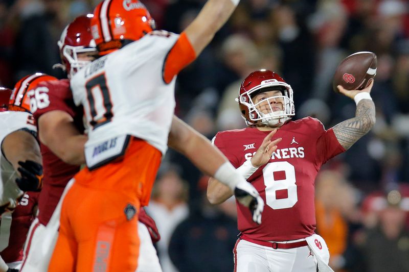 Nov 19, 2022; Norman, Oklahoma, USA; Oklahoma Sooners quarterback Dillon Gabriel (8) throws a pass against the Oklahoma State Cowboys during a game at Gaylord Family-Oklahoma Memorial Stadium. Mandatory Credit: Bryan Terry-USA TODAY Sports