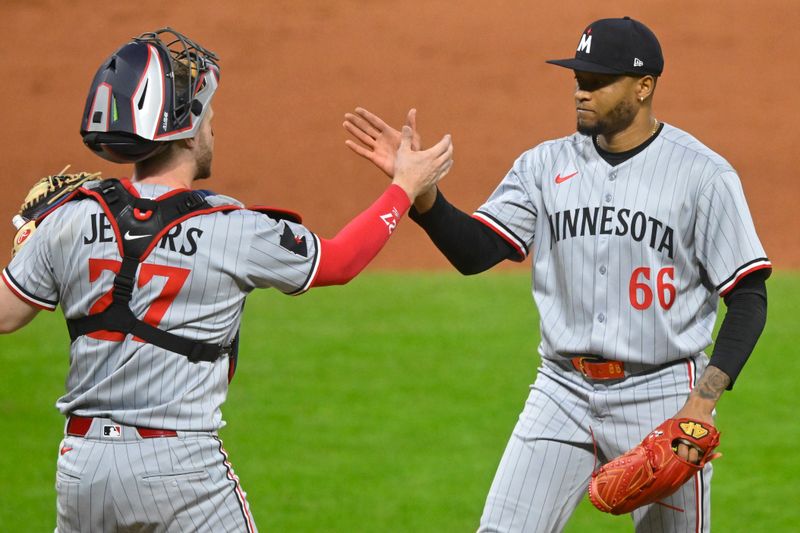 Apr 28, 2025; Cleveland, Ohio, USA; Minnesota Twins catcher Ryan Jeffers (27) and relief pitcher Jorge Alcala (66) celebrate a win over the Cleveland Guardians at Progressive Field. Mandatory Credit: David Richard-Imagn Images
