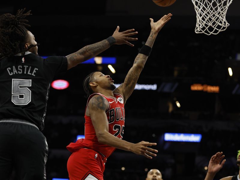 SAN ANTONIO, TX - DECEMBER 5: Dalen Terry #25 of the Chicago Bulls scores past Stephon Castle #5 of the San Antonio Spurs in the second half at Frost Bank Center on December 5, 2024 in San Antonio, Texas. NOTE TO USER: User expressly acknowledges and agrees that, by downloading and or using this photograph, User is consenting to terms and conditions of the Getty Images License Agreement. (Photo by Ronald Cortes/Getty Images)