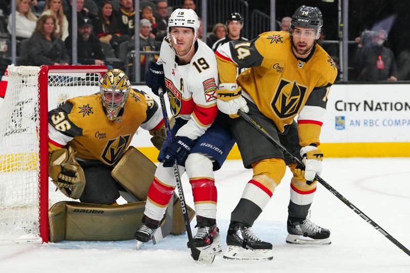 Jan 4, 2024; Las Vegas, Nevada, USA; Florida Panthers left wing Matthew Tkachuk (19) stands between Vegas Golden Knights goaltender Logan Thompson (36) and Vegas Golden Knights defenseman Nicolas Hague (14) during the third period at T-Mobile Arena. Mandatory Credit: Stephen R. Sylvanie-USA TODAY Sports