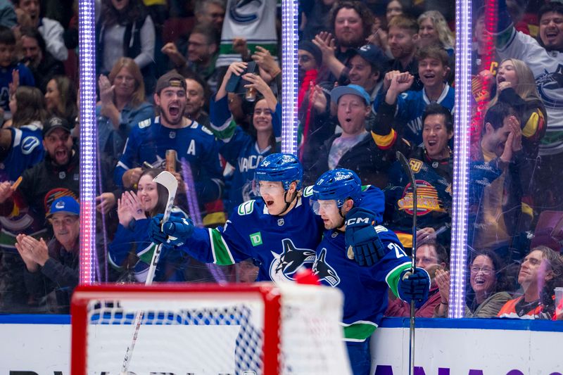 Oct 11, 2024; Vancouver, British Columbia, CAN; Vancouver Canucks forward Aatu Raty (54) and forward Nils Hoglander (21) celebrate Hoglander’s goal against the Philadelphia Flyers during the first period at Rogers Arena. Mandatory Credit: Bob Frid-Imagn Images