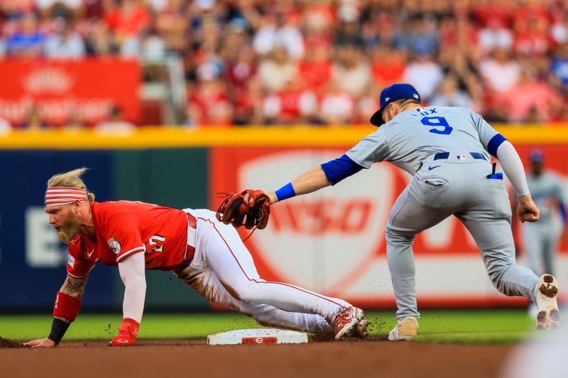 May 25, 2024; Cincinnati, Ohio, USA; Cincinnati Reds outfielder Jake Fraley (27) steals second against Los Angeles Dodgers second baseman Gavin Lux (9) in the first inning at Great American Ball Park. Mandatory Credit: Katie Stratman-USA TODAY Sports