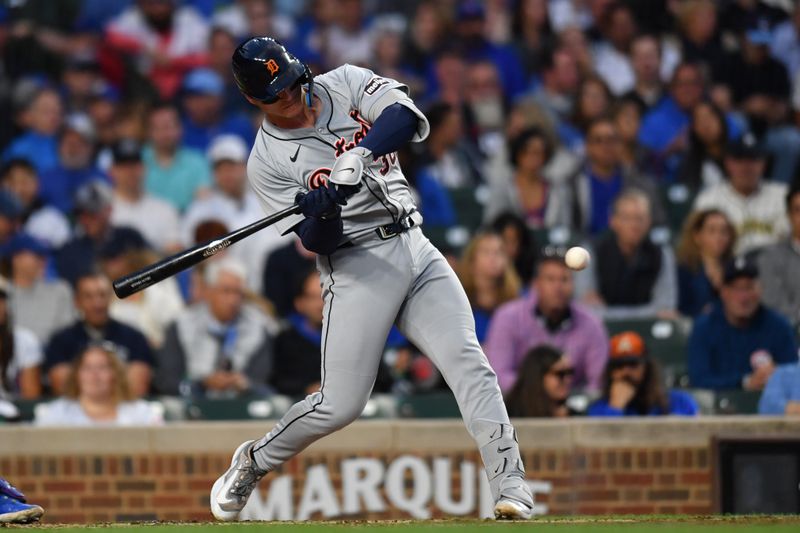 Aug 20, 2024; Chicago, Illinois, USA; Detroit Tigers catcher Dillon Dingler (38) hits an RBI single during the second inning against the Chicago Cubs at Wrigley Field. Mandatory Credit: Patrick Gorski-USA TODAY Sports