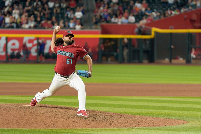Sep 21, 2025; Phoenix, Arizona, USA; Arizona Diamondbacks pitcher Nabil Crismatt (61) on the mound to pitch in the ninth inning against the Philadelphia Phillies at Chase Field. Mandatory Credit: Allan Henry-Imagn Images