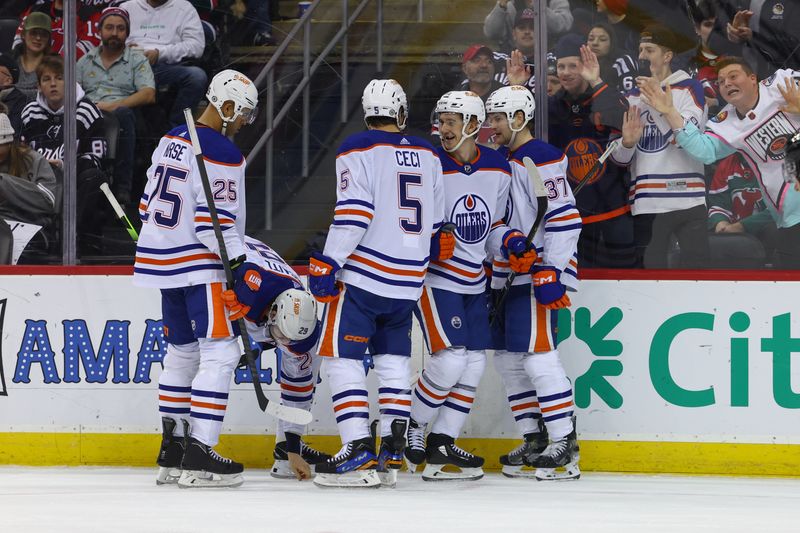 Dec 21, 2023; Newark, New Jersey, USA; Edmonton Oilers center Ryan McLeod (71) celebrates his goal against the New Jersey Devils during the third period at Prudential Center. Mandatory Credit: Ed Mulholland-USA TODAY Sports