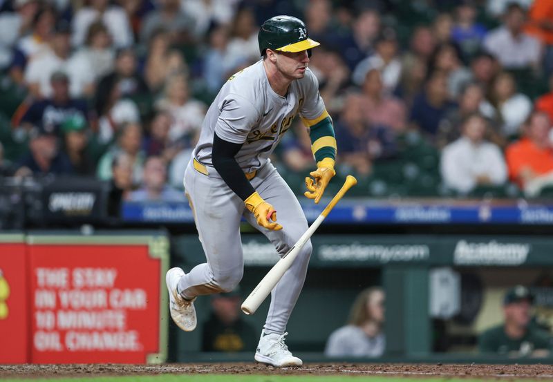 Sep 11, 2024; Houston, Texas, USA; Oakland Athletics designated hitter Brent Rooker (25) hits an RBI single during the sixth inning against the Houston Astros at Minute Maid Park. Mandatory Credit: Troy Taormina-Imagn Images