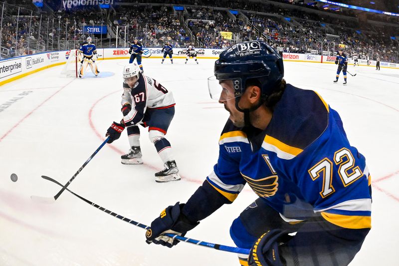 Oct 1, 2024; St. Louis, Missouri, USA;  St. Louis Blues defenseman Justin Faulk (72) and Columbus Blue Jackets left wing James Malatesta (67) battle during the first period at Enterprise Center. Mandatory Credit: Jeff Curry-Imagn Images