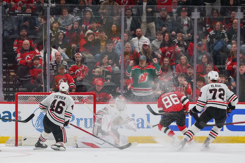 Mar 29, 2026; Newark, New Jersey, USA; New Jersey Devils center Jack Hughes (86) scores a goal against the Chicago Blackhawks during the third period at Prudential Center. Mandatory Credit: Ed Mulholland-Imagn Images