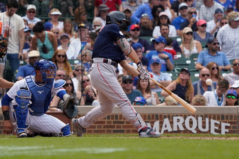 Jul 16, 2023; Chicago, Illinois, USA; Boston Red Sox left fielder Masataka Yoshida (7) hits a two-run triple against the Chicago Cubs during the seventh inning at Wrigley Field. Mandatory Credit: David Banks-USA TODAY Sports