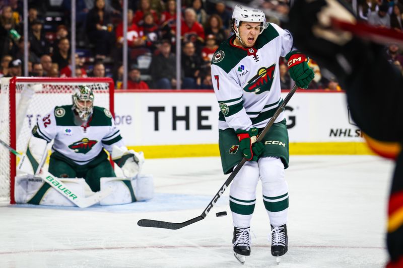 Dec 4, 2025; Calgary, Alberta, CAN; Minnesota Wild defenseman Brock Faber (7) blocks the shot against the Calgary Flames during the second period at Scotiabank Saddledome. Mandatory Credit: Sergei Belski-Imagn Images
