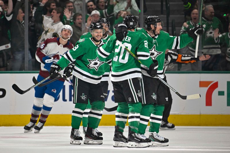 May 7, 2024; Dallas, Texas, USA; Dallas Stars right wing Evgenii Dadonov (63) and defenseman Ryan Suter (20) and center Matt Duchene (95) celebrates a goal scored by Suter against the Colorado Avalanche during the first period in game one of the second round of the 2024 Stanley Cup Playoffs at American Airlines Center. Mandatory Credit: Jerome Miron-USA TODAY Sports