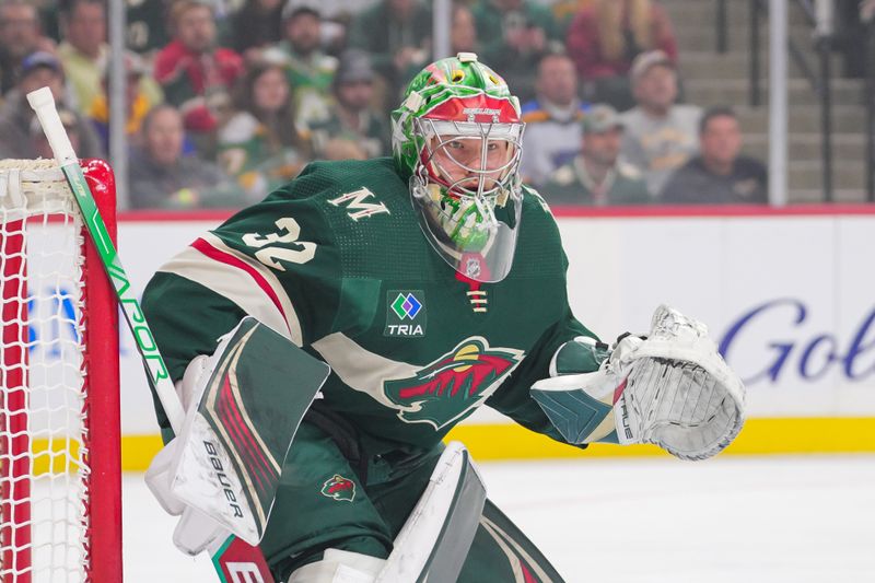 Nov 28, 2023; Saint Paul, Minnesota, USA; Minnesota Wild goaltender Filip Gustavsson (32) watches the puck against the St. Louis Blues in the first period at Xcel Energy Center. Mandatory Credit: Brad Rempel-USA TODAY Sports