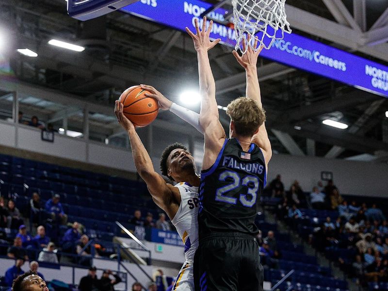 Jan 13, 2024; Colorado Springs, Colorado, USA; San Jose State Spartans guard Myron Amey Jr. (0) drives to the net against Air Force Falcons guard Kellan Boylan (23) in the second half at Clune Arena. Mandatory Credit: Isaiah J. Downing-USA TODAY Sports