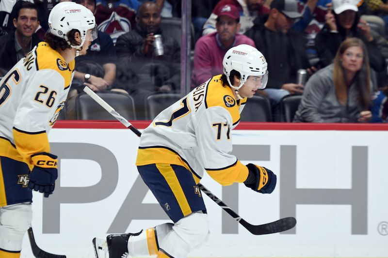 Nov 11, 2024; Denver, Colorado, USA; Nashville Predators right wing Luke Evangelista (77) skates after scoring during the first period against the Colorado Avalanche at Ball Arena. Mandatory Credit: Christopher Hanewinckel-Imagn Images