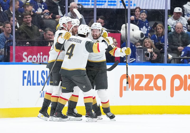 Jan 23, 2026; Toronto, Ontario, CAN; Vegas Golden Knights right wing Mark Stone (61) scores a goal and celebrates with defenceman Rasmus Andersson (4) against the Toronto Maple Leafs during the third period at Scotiabank Arena. Mandatory Credit: Nick Turchiaro-Imagn Images