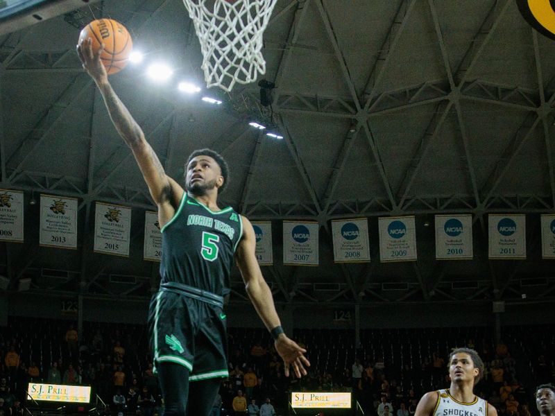 Jan 4, 2024; Wichita, Kansas, USA; North Texas Mean Green guard Rondel Walker (5) puts up a shot during the second half against the Wichita State Shockers at Charles Koch Arena. Mandatory Credit: William Purnell-USA TODAY Sports