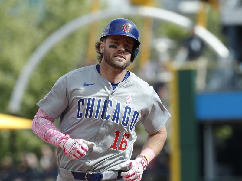 May 12, 2024; Pittsburgh, Pennsylvania, USA;  Chicago Cubs first baseman Patrick Wisdom (16) circles the bases on a solo home run against the Pittsburgh Pirates during the tenth inning at PNC Park. The Cubs won 5-4 in ten innings. Mandatory Credit: Charles LeClaire-USA TODAY Sports