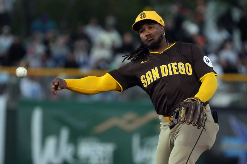 Mar 18, 2025; Scottsdale, Arizona, USA; San Diego Padres third base Eguy Rosario (5) makes the play for an out against the San Francisco Giants in the second inning at Scottsdale Stadium. Mandatory Credit: Rick Scuteri-Imagn Images