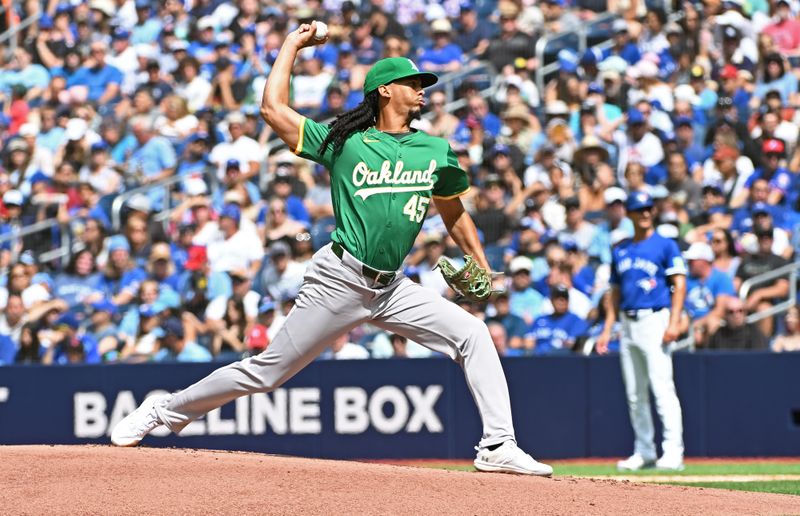 Aug 10, 2024; Toronto, Ontario, CAN; Oakland Athletics pitcher Osvaldo Bido (45) pitches in the first inning against the Toronto Blue Jays at Rogers Centre. Mandatory Credit: Gerry Angus-USA TODAY Sports