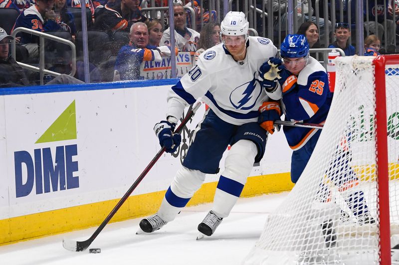 Apr 6, 2023; Elmont, New York, USA; New York Islanders defenseman Sebastian Aho (25) defends against Tampa Bay Lightning right wing Corey Perry (10) during the third period at UBS Arena. Mandatory Credit: Dennis Schneidler-USA TODAY Sports