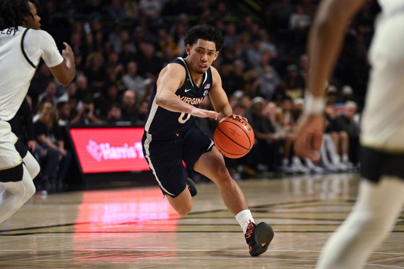 Jan 21, 2023; Winston-Salem, North Carolina, USA;   Virginia Cavaliers guard Kihei Clark (0) drives towards the lane against the Wake Forest Demon Deacons during the second half at Lawrence Joel Veterans Memorial Coliseum. Mandatory Credit: William Howard-USA TODAY Sports