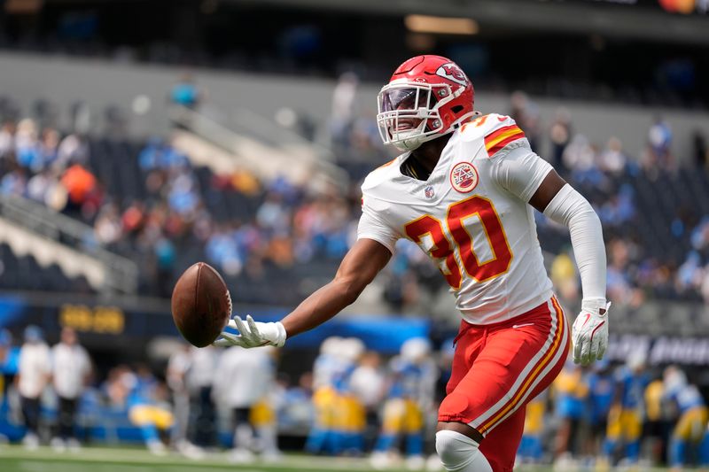 Kansas City Chiefs cornerback Chris Roland-Wallace warms up before the start of an NFL football game against the Los Angeles Chargers Sunday, Sept. 29, 2024, in Inglewood, Calif. (AP Photo/Ashley Landis)