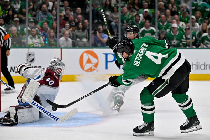 May 15, 2024; Dallas, Texas, USA; Dallas Stars defenseman Miro Heiskanen (4) scores a power play goal on a pass from left wing Jason Robertson (21) against Colorado Avalanche goaltender Alexandar Georgiev (40) during the second period in game five of the second round of the 2024 Stanley Cup Playoffs at American Airlines Center. Mandatory Credit: Jerome Miron-USA TODAY Sports