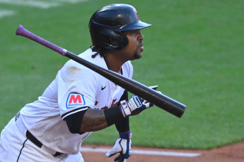 May 18, 2024; Cleveland, Ohio, USA; Cleveland Guardians third baseman Jose Ramirez (11) watches his RBI double in the third inning against the Minnesota Twins at Progressive Field. Mandatory Credit: David Richard-USA TODAY Sports