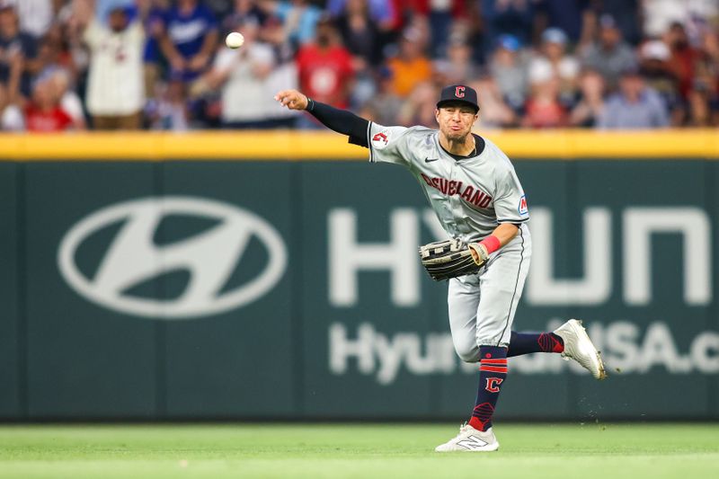 Apr 26, 2024; Atlanta, Georgia, USA; Cleveland Guardians center fielder Tyler Freeman (2) throws home against the Atlanta Braves in the fourth inning at Truist Park. Mandatory Credit: Brett Davis-USA TODAY Sports