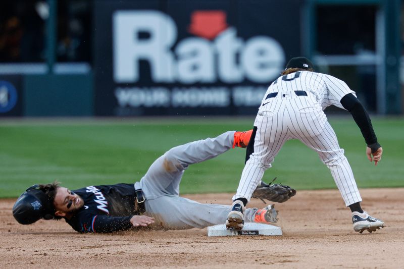May 10, 2025; Chicago, Illinois, USA; Miami Marlins third baseman Connor Norby (1) steals second base against Chicago White Sox second base Chase Meidroth (10) during the second inning at Rate Field. Mandatory Credit: Kamil Krzaczynski-Imagn Images