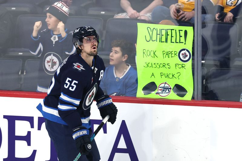 Jan 7, 2025; Winnipeg, Manitoba, CAN; Winnipeg Jets center Mark Scheifele (55) skates past fans before a game against the Nashville Predators at Canada Life Centre. Mandatory Credit: James Carey Lauder-Imagn Images