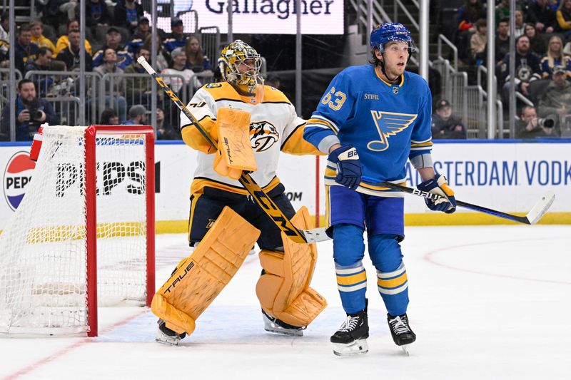 Feb 17, 2024; St. Louis, Missouri, USA; Nashville Predators goaltender Juuse Saros (74) defends the net from St. Louis Blues left wing Jake Neighbours (63) during the second period at Enterprise Center. Mandatory Credit: Jeff Le-USA TODAY Sports