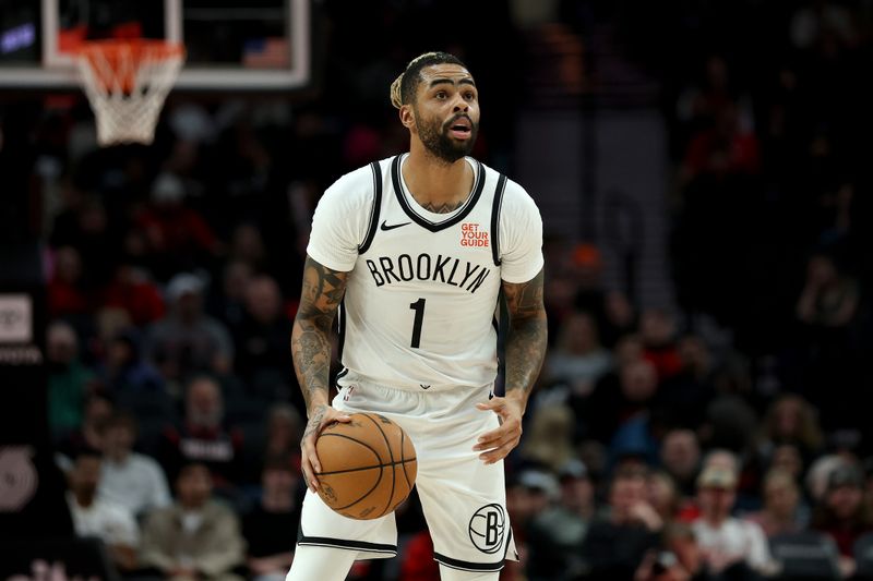 PORTLAND, OREGON - JANUARY 14: D'Angelo Russell #1 of the Brooklyn Nets looks on during the second half against the Portland Trail Blazers at Moda Center on January 14, 2025 in Portland, Oregon. NOTE TO USER: User expressly acknowledges and agrees that, by downloading and or using this photograph, User is consenting to the terms and conditions of the Getty Images License Agreement. (Photo by Steph Chambers/Getty Images)