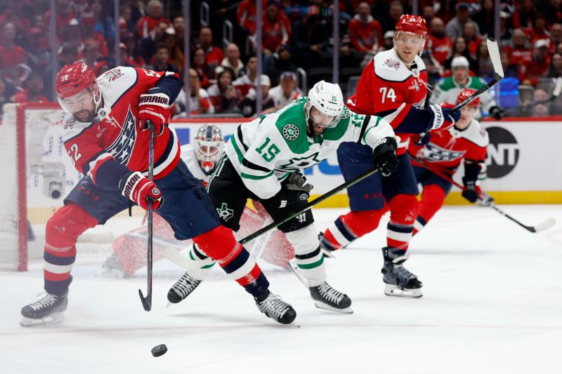 Jan 7, 2026; Washington, District of Columbia, USA; Washington Capitals defenseman Dylan McIlrath (52) clears the puck from Dallas Stars center Colin Blackwell (15) during the second period at Capital One Arena. Mandatory Credit: Geoff Burke-Imagn Images