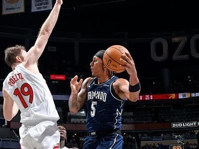 ORLANDO, FL - NOVEMBER 21: Paolo Banchero #5 of the Orlando Magic looks to pass the ball during the game against the Toronto Raptors during the In-Season Tournament on November 21, 2023 at Amway Center in Orlando, Florida. NOTE TO USER: User expressly acknowledges and agrees that, by downloading and or using this photograph, User is consenting to the terms and conditions of the Getty Images License Agreement. Mandatory Copyright Notice: Copyright 2023 NBAE (Photo by Fernando Medina/NBAE via Getty Images)