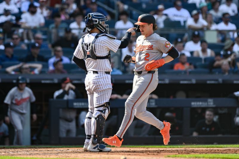 Jun 20, 2024; Bronx, New York, USA; Baltimore Orioles shortstop Gunnar Henderson (2) scores a run on a sacrifice fly by first baseman Ryan O'Hearn (not pictured) during the third inning against the New York Yankees at Yankee Stadium. Mandatory Credit: John Jones-USA TODAY Sports