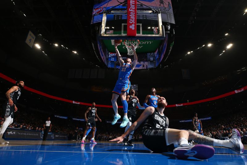 OKLAHOMA CITY, OK - APRIL 10:  Gordon Hayward #33 of the Oklahoma City Thunder drives to the basket during the game against the San Antonio Spurs on April 10, 2024 at Paycom Arena in Oklahoma City, Oklahoma. NOTE TO USER: User expressly acknowledges and agrees that, by downloading and or using this photograph, User is consenting to the terms and conditions of the Getty Images License Agreement. Mandatory Copyright Notice: Copyright 2024 NBAE (Photo by Zach Beeker/NBAE via Getty Images)