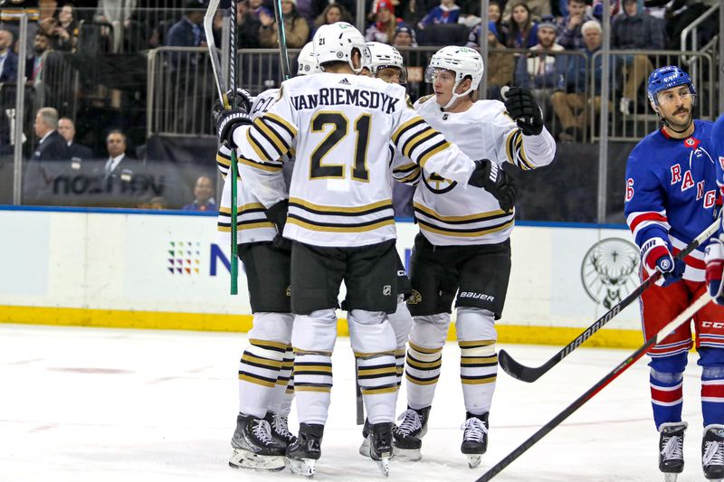 Nov 25, 2023; New York, New York, USA; Boston Bruins center Charlie Coyle (13) celebrates his goal with left wing James van Riemsdyk (21) during the first period against the New York Rangers at Madison Square Garden. Mandatory Credit: Danny Wild-USA TODAY Sports