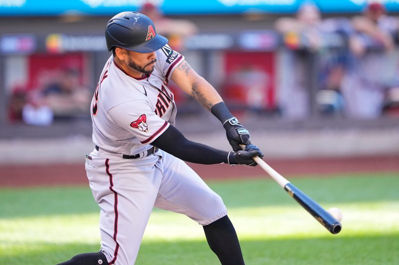 Sep 14, 2023; New York City, New York, USA; Arizona Diamondbacks left fielder Tommy Pham (28) hits a single agaimst the New York Mets during the first inning at Citi Field. Mandatory Credit: Gregory Fisher-USA TODAY Sports