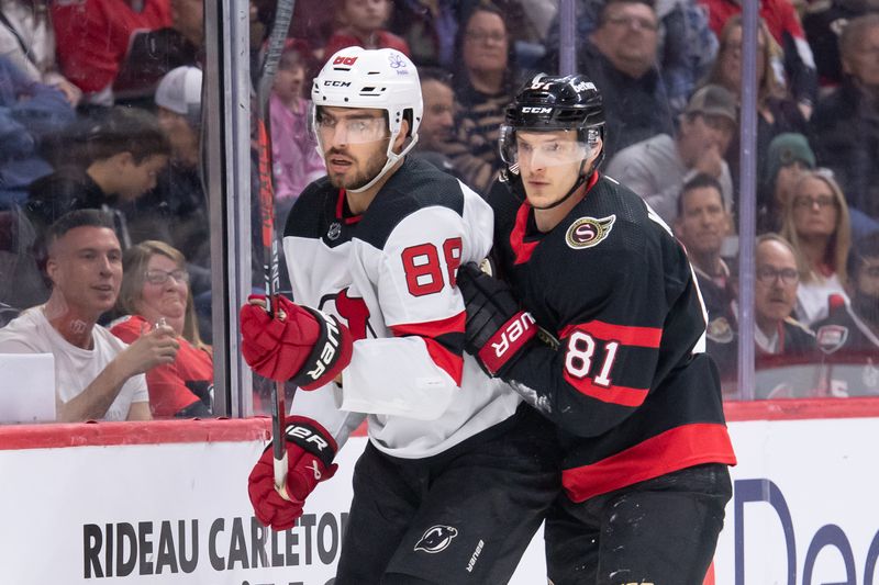 Apr 6, 2024; Ottawa, Ontario, CAN; New Jersey Devils defenseman Kevin Bahl (88) and Ottawa Senators left wing Dominik Kubalik (81) follow the puck in the first period at the Canadian Tire Centre. Mandatory Credit: Marc DesRosiers-USA TODAY Sports