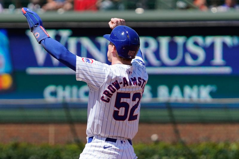 Aug 7, 2024; Chicago, Illinois, USA; Chicago Cubs outfielder Pete Crow-Armstrong (52) gestures after stealing second base against the Minnesota Twins during the third inning at Wrigley Field. Mandatory Credit: David Banks-USA TODAY Sports