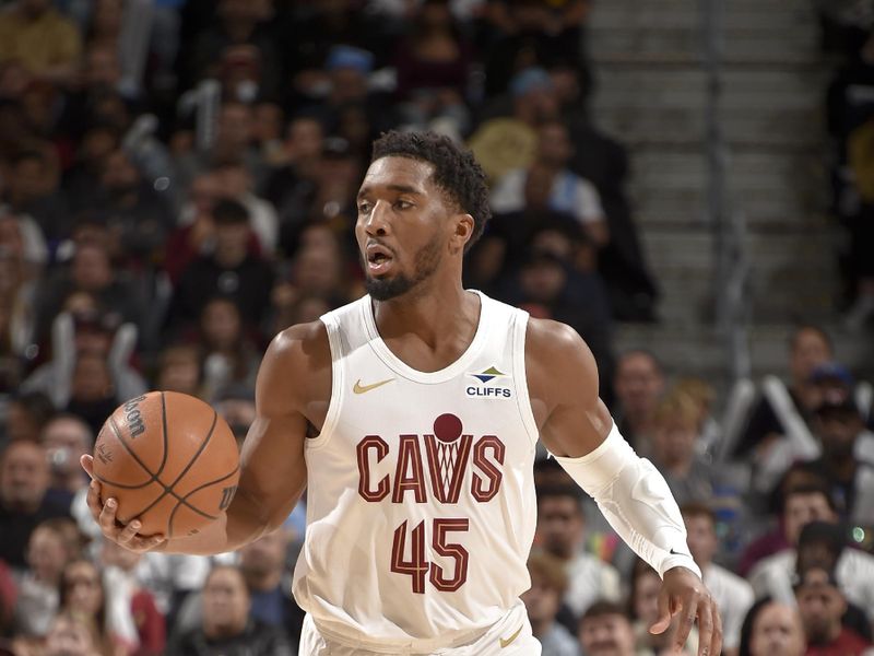 CLEVELAND, OH - NOVEMBER 24: Donovan Mitchell #45 of the Cleveland Cavaliers handles the ball during the game against the Toronto Raptors on November 24, 2024 at Rocket Mortgage FieldHouse in Cleveland, Ohio. NOTE TO USER: User expressly acknowledges and agrees that, by downloading and/or using this Photograph, user is consenting to the terms and conditions of the Getty Images License Agreement. Mandatory Copyright Notice: Copyright 2024 NBAE (Photo by David Liam Kyle/NBAE via Getty Images)