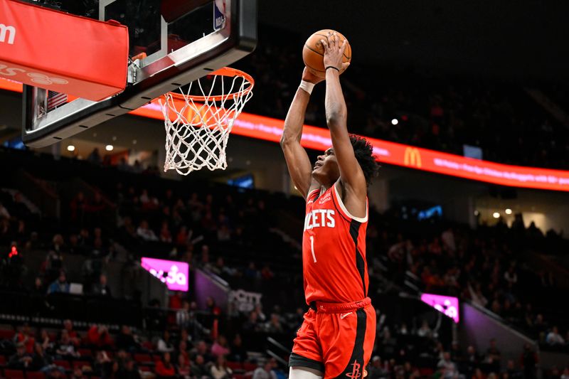 PORTLAND, OREGON - MARCH 08: Amen Thompson #1 of the Houston Rockets dunks during the fourth quarter of the game against the Portland Trail Blazers at the Moda Center on March 08, 2024 in Portland, Oregon. The Houston Rockets won 123-107. NOTE TO USER: User expressly acknowledges and agrees that, by downloading and or using this photograph, User is consenting to the terms and conditions of the Getty Images License Agreement. (Photo by Alika Jenner/Getty Images)