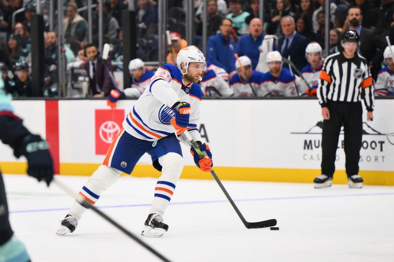 Oct 2, 2024; Seattle, Washington, USA; Edmonton Oilers center Leon Draisaitl (29) advances the puck against the Seattle Kraken during the second period at Climate Pledge Arena. Mandatory Credit: Steven Bisig-Imagn Images