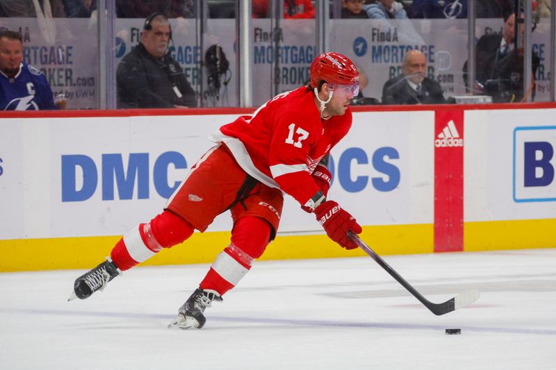 Jan 21, 2024; Detroit, Michigan, USA; Detroit Red Wings right wing Daniel Sprong (17) handles the puck during the first period at Little Caesars Arena. Mandatory Credit: Brian Bradshaw Sevald-USA TODAY Sports