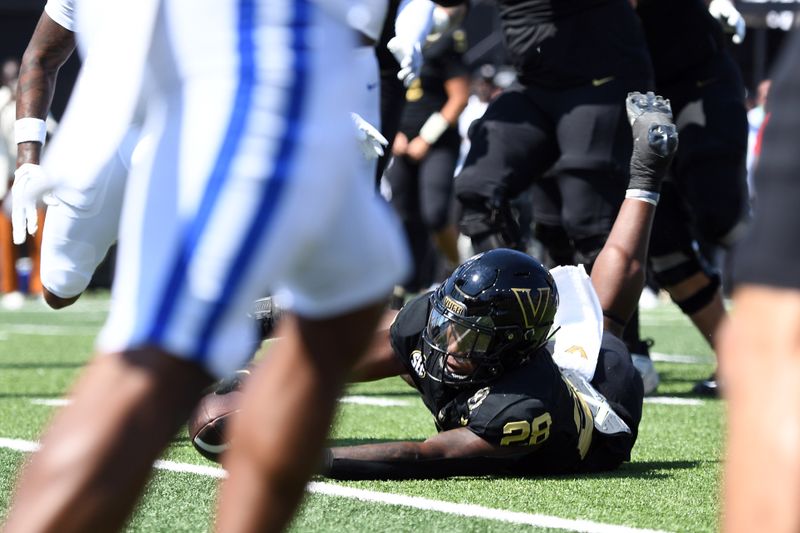 Sep 23, 2023; Nashville, Tennessee, USA; Vanderbilt Commodores running back Sedrick Alexander (28) reaches the ball over the goal line for a touchdown during the first half against the Kentucky Wildcats at FirstBank Stadium. Mandatory Credit: Christopher Hanewinckel-USA TODAY Sports