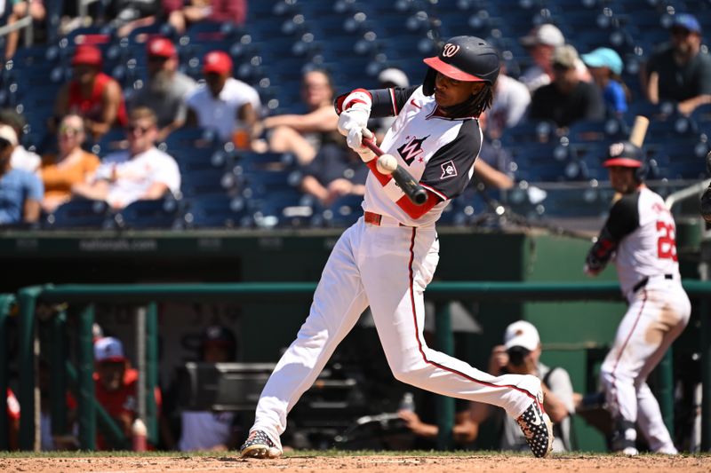 Jul 7, 2024; Washington, District of Columbia, USA; Washington Nationals shortstop CJ Abrams (5) hits the ball into play against the St. Louis Cardinals during the fifth inning at Nationals Park. Mandatory Credit: Rafael Suanes-USA TODAY Sports