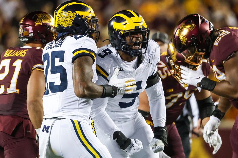 Oct 7, 2023; Minneapolis, Minnesota, USA; Michigan Wolverines defensive end Josaiah Stewart (5) celebrates a tackle against the Minnesota Golden Gophers during the second quarter at Huntington Bank Stadium. Mandatory Credit: Matt Krohn-USA TODAY Sports