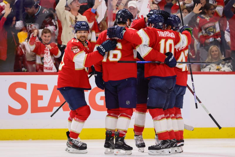 May 14, 2024; Sunrise, Florida, USA; Florida Panthers center Sam Reinhart (13) celebrates with teammates after scoring against the Boston Bruins during the second period in game five of the second round of the 2024 Stanley Cup Playoffs at Amerant Bank Arena. Mandatory Credit: Sam Navarro-USA TODAY Sports