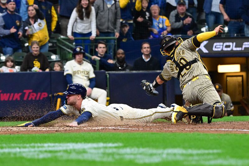 Apr 17, 2024; Milwaukee, Wisconsin, USA; Milwaukee Brewers second baseman Brice Turang (2) scores before tag by San Diego Padres catcher Kyle Higashioka (20) in the eighth inning at American Family Field. Mandatory Credit: Benny Sieu-USA TODAY Sports